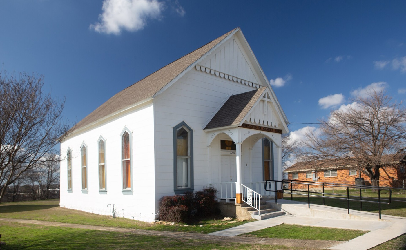 Small white historic church building in Watauga, Texas