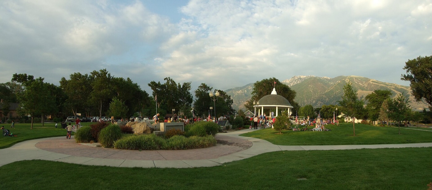 Gazebo and lawns at Draper Historic Park with the Wasatch Mountains behind