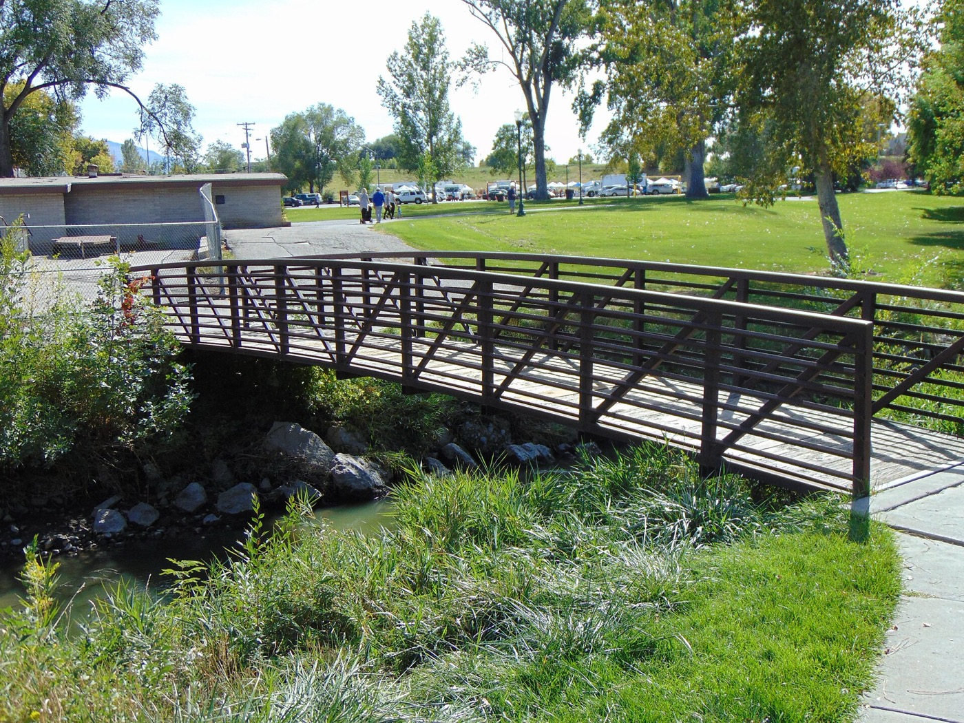 Footbridge over Little Cottonwood Creek in Murray City Park in autumn