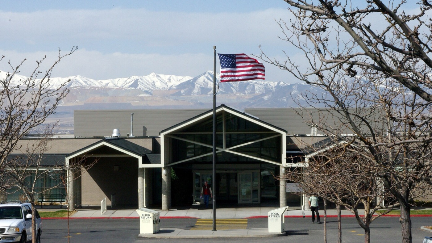 Sandy branch of the Salt Lake County Library with the snow-capped Oquirrh Mountains across the valley